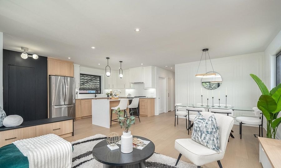 Open-concept living, dining and kitchen after renovation