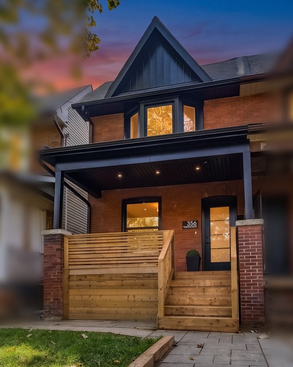 356 Woodfield Rd., a renovated century semi with a black gable, brick front and cedar porch